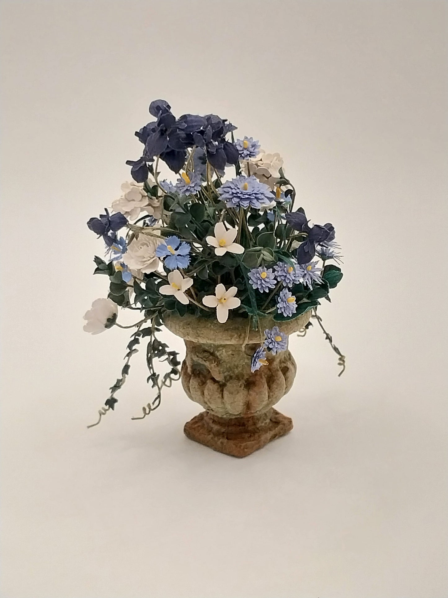 Flower Arrangement In Aged Urn, White Rose & Purple Iris