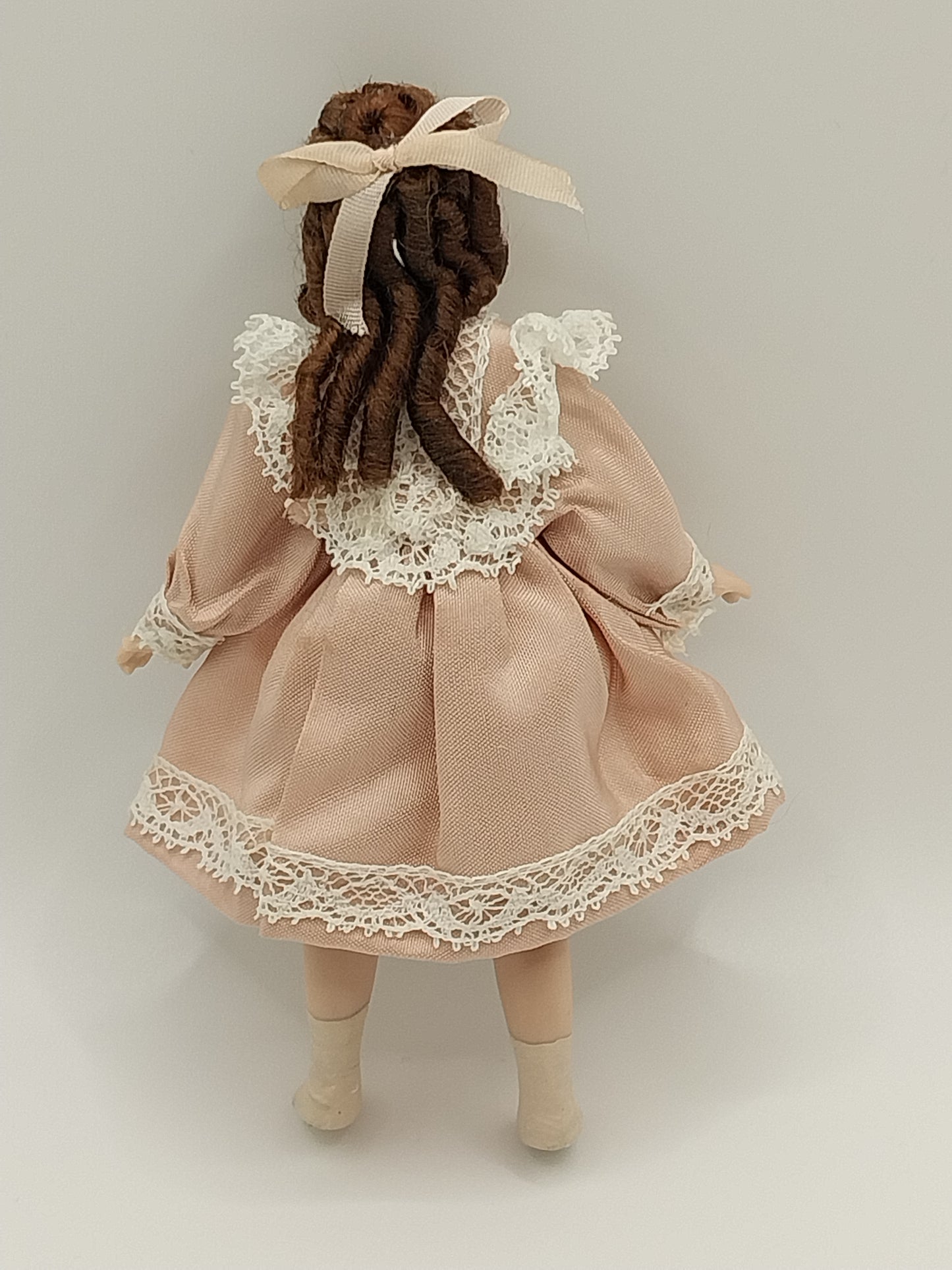 Young Girl Doll with Brown Hair & Rose Dress