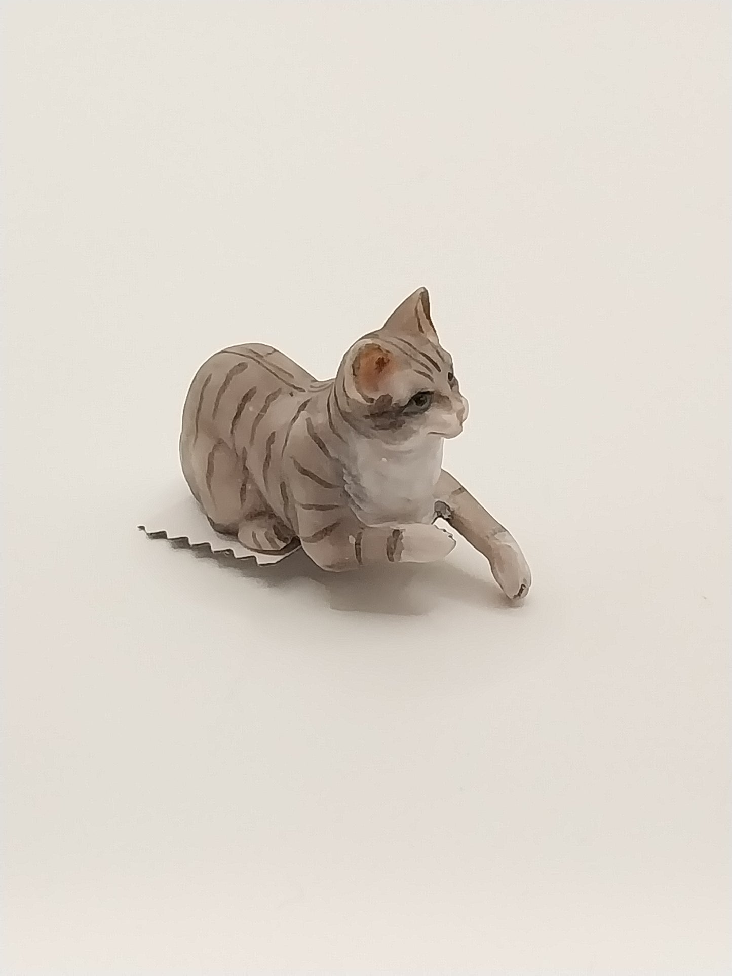 Laying Cat with Paw Hanging, Grey Tabby