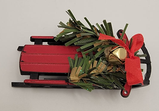 Snow Sled Filled with Pine Cones