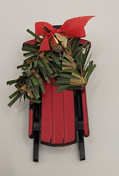 Snow Sled Filled with Pine Cones