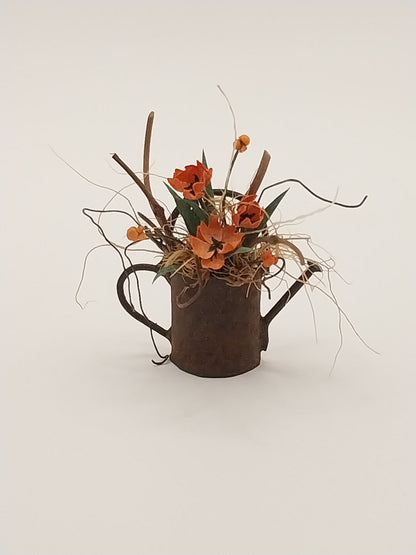 Floral Arrangement In Rusty Watering Can