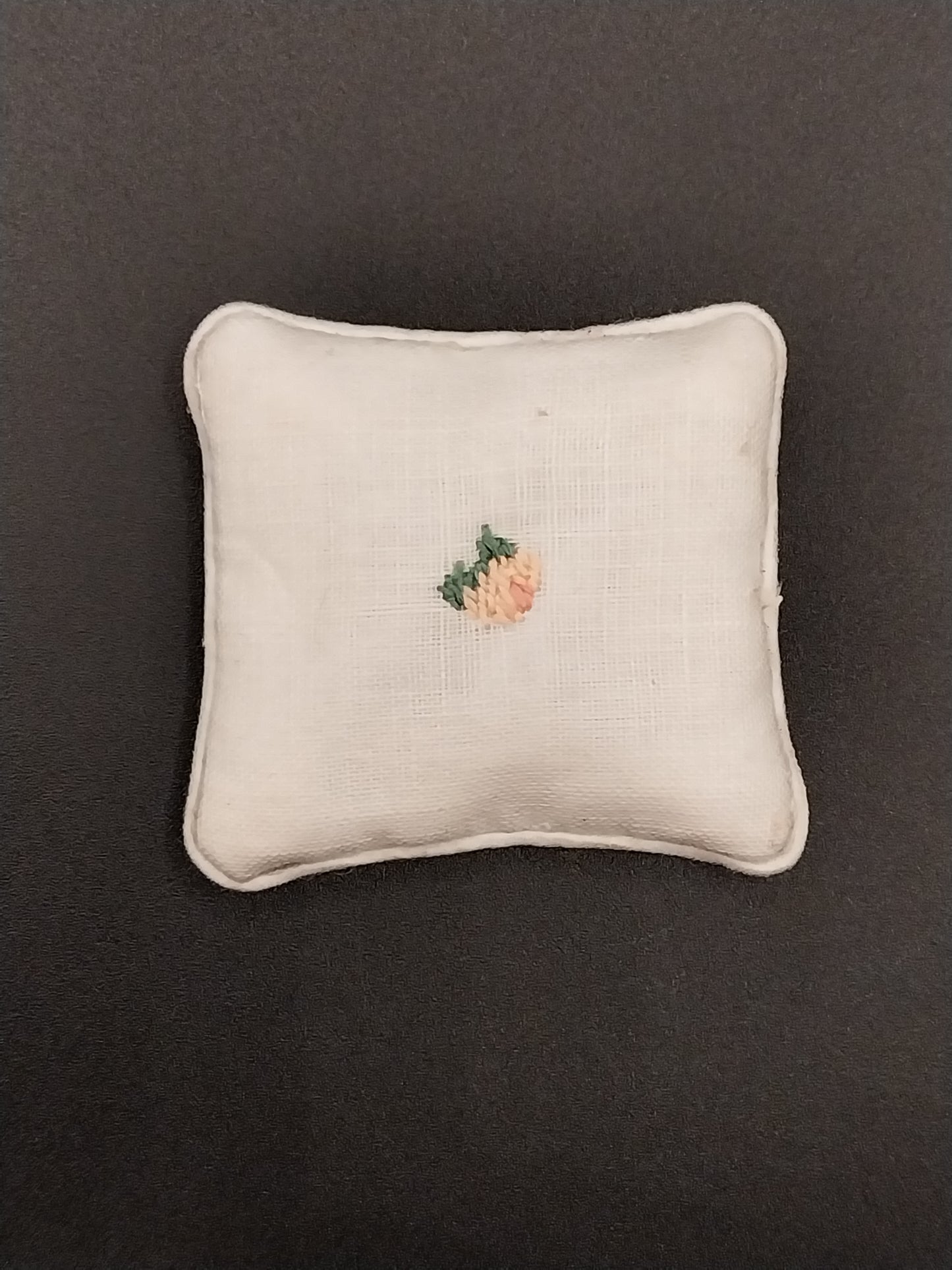 White Pillow With Needlework Rose