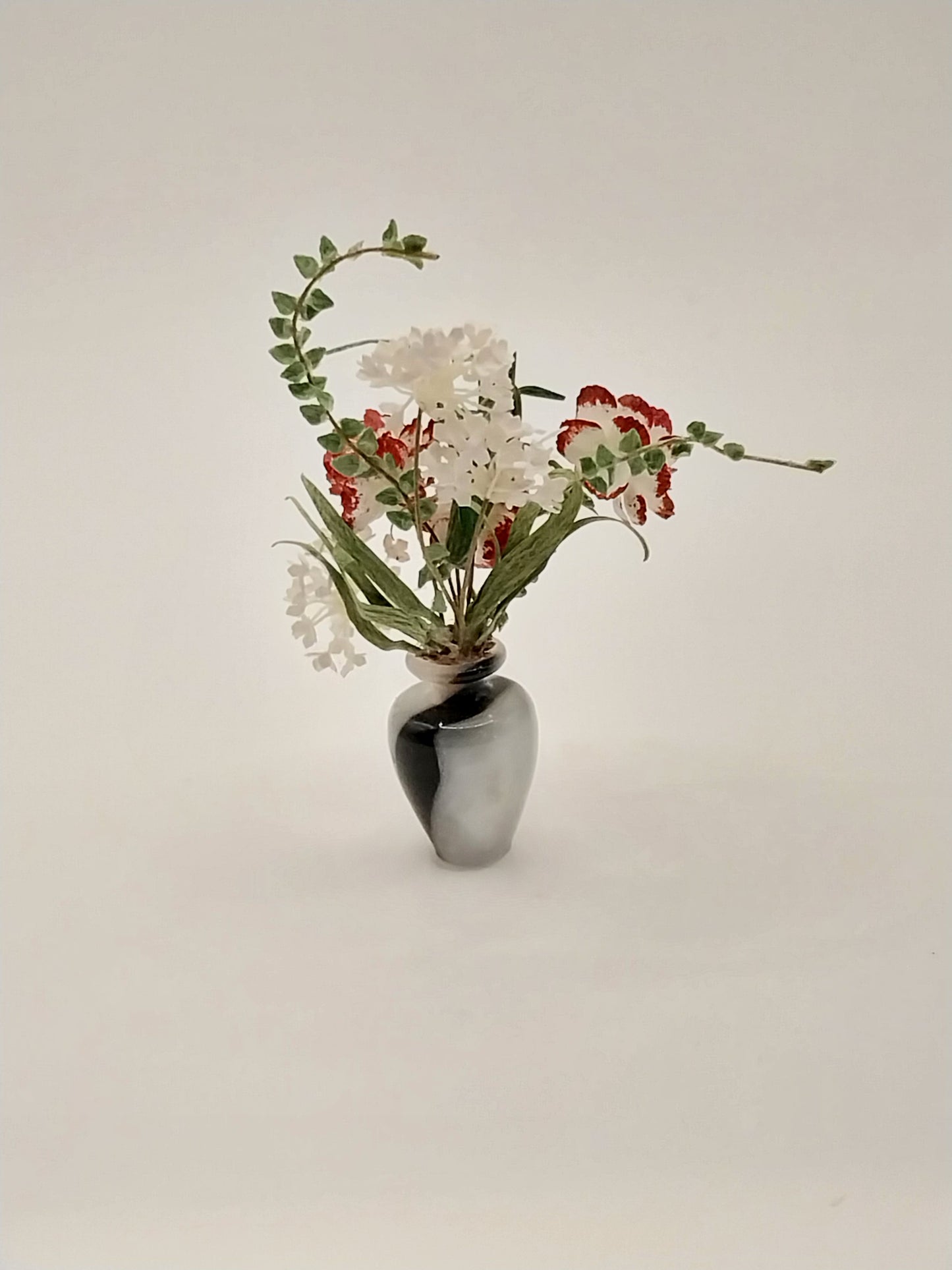 Floral Arrangement In Turn Acrylic Vase