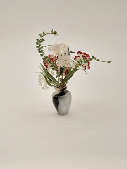 Floral Arrangement In Turn Acrylic Vase