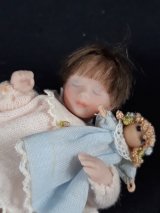 Toddler Sleeping with Doll