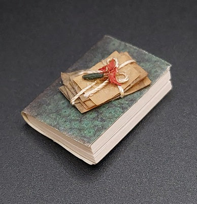 Book with Stack of Love Letters