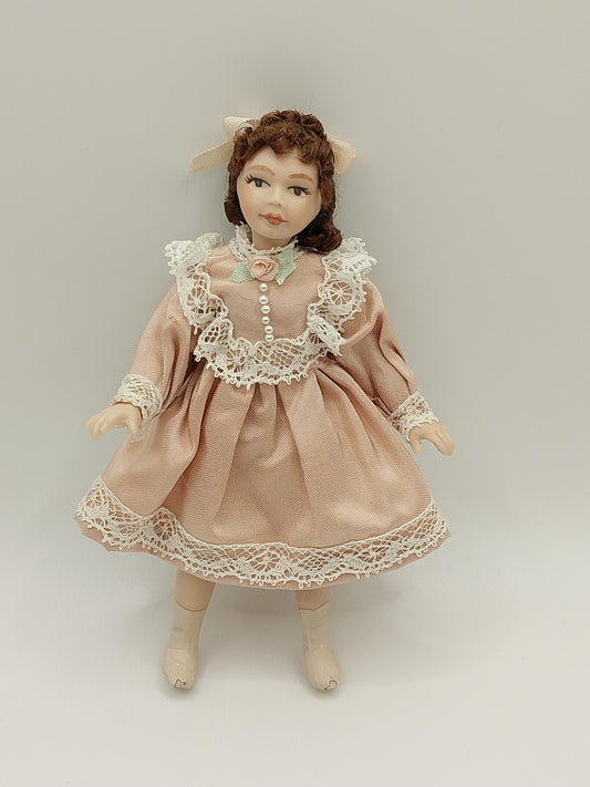 Young Girl Doll with Brown Hair & Rose Dress