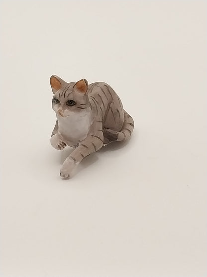 Laying Cat with Paw Hanging, Grey Tabby