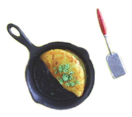 Omelet In Frying Pan with Spatula