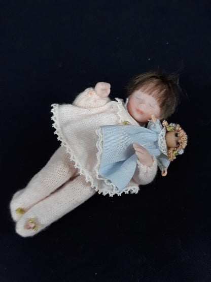 Toddler Sleeping with Doll