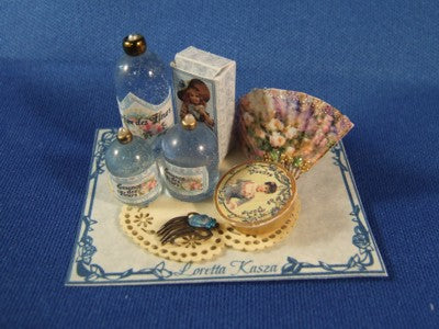 Perfume on Tray with Fan and Comb