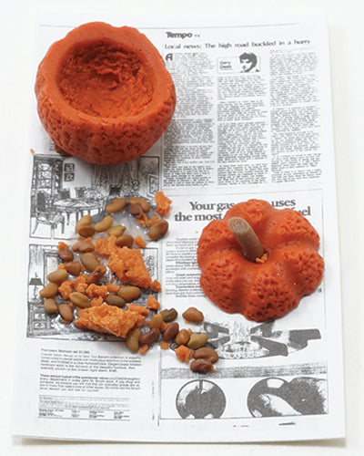 Carved Pumpkin on Newspaper
